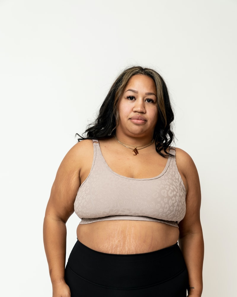 Front of a model wearing a size XL Olivia Sports Bra *Leopard in Blush Leopard by Gold Elite Apparel. | dia_product_style_image_id:284721